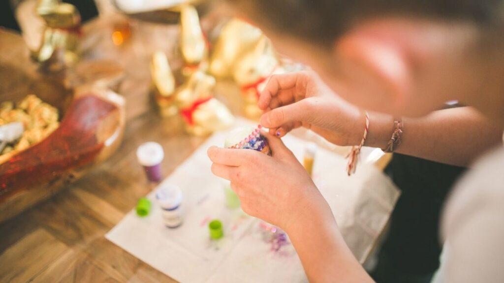 A child using their hands to make a craft