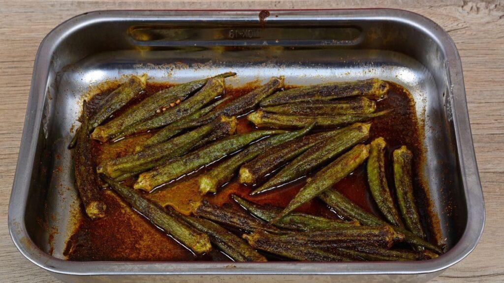 Okra being cooked and dried in an oven dish